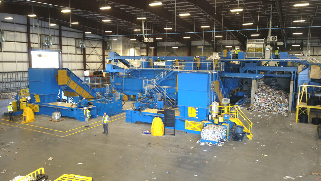 blue and yellow auto tie single ram baler