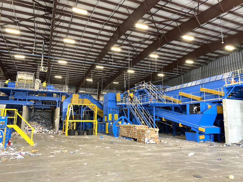 blue and yellow auto tie single ram baler