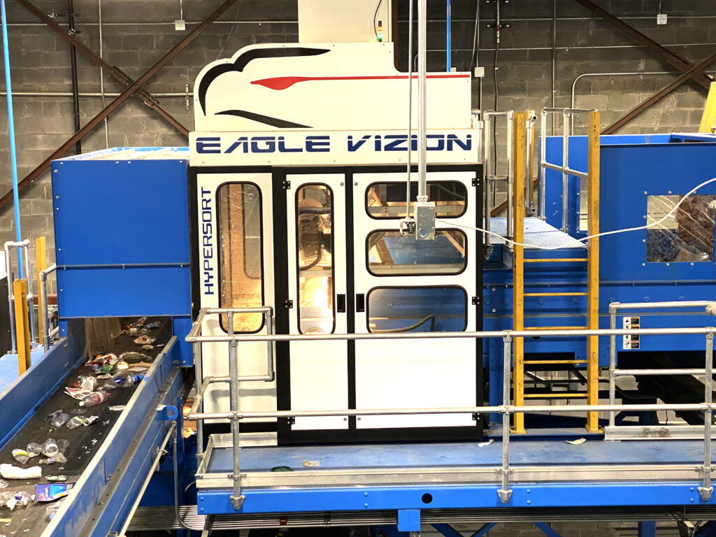 white and blue recycling equipment